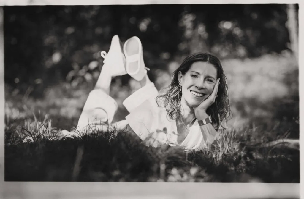 shelley stewart black and white photo laughing at the camera
